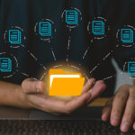 a man holds a virtual folder in his hand